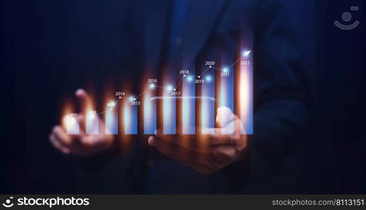 Trader holding digital graph on technology visual screen for trading online stock market forex or stock exchange