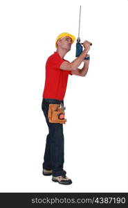 Tradesman adding an extension to his screw gun