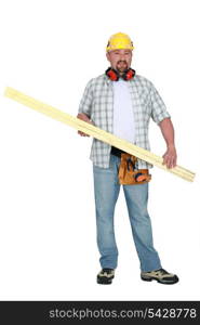 Tradesman carrying a plank of wood