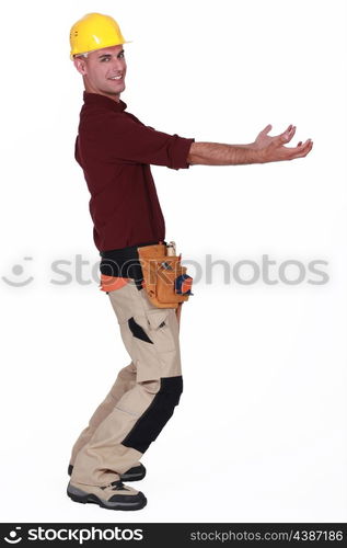 Tradesman carrying an invisible object