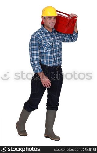 Tradesman carrying his toolbox