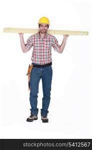 Tradesman carrying planks of wood