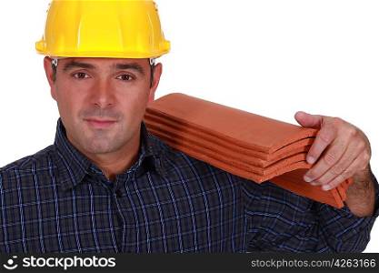 Tradesman carrying shingles