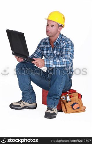 Tradesman checking his emails