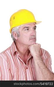 Tradesman deep in thought