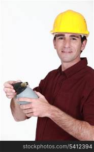Tradesman holding a blowtorch