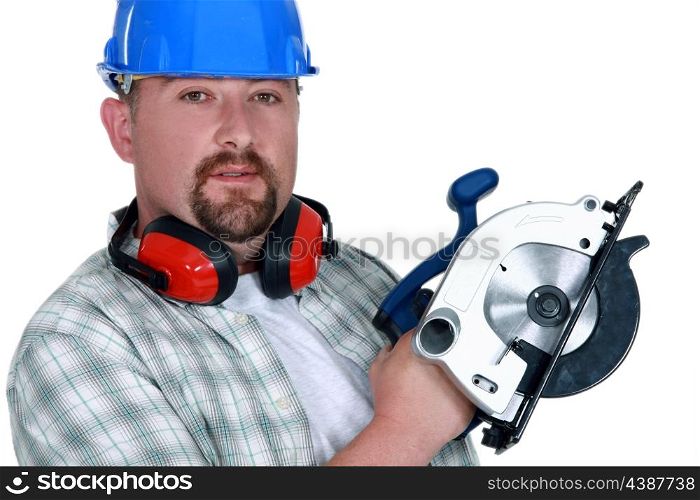 Tradesman holding a circular saw