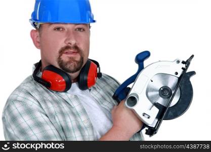 Tradesman holding a circular saw