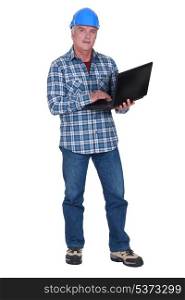 Tradesman holding a laptop