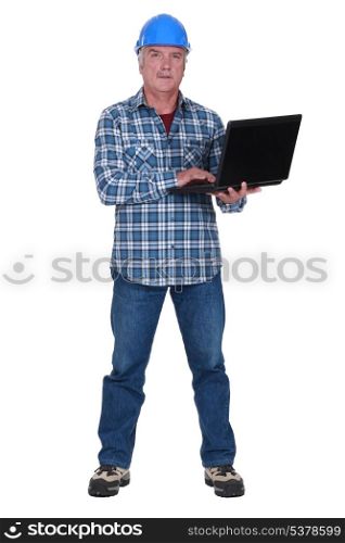 Tradesman holding a laptop