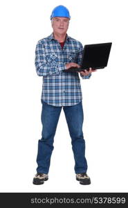 Tradesman holding a laptop