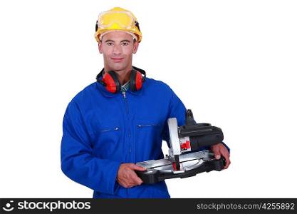Tradesman holding a mitre saw