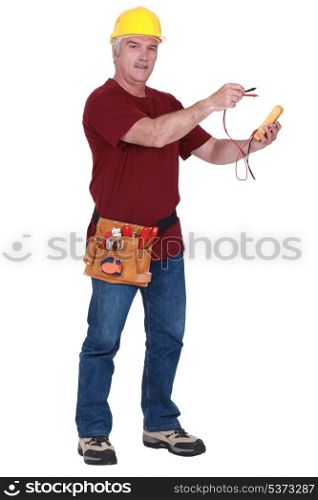 Tradesman holding a multimeter