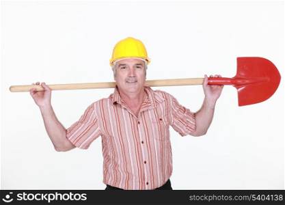 Tradesman holding a shovel