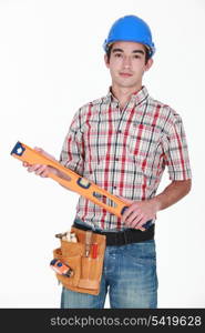 Tradesman holding a spirit level