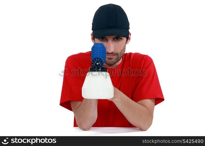 Tradesman holding a spray gun