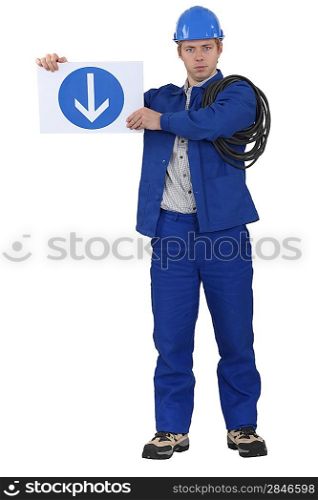 Tradesman holding a traffic sign