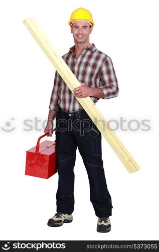 Tradesman holding a wooden plank