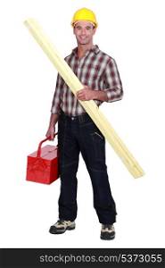 Tradesman holding a wooden plank