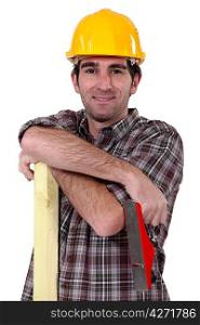 Tradesman holding a wooden plank and a plane