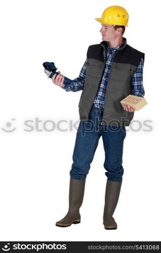 Tradesman holding an angle grinder