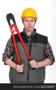 Tradesman holding large clippers