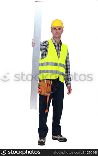 Tradesman holding up a girder