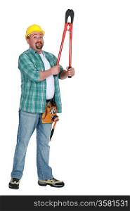 Tradesman holding up a pair of large clippers
