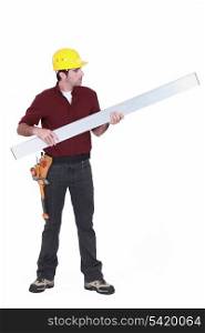 Tradesman holding up a steel girder