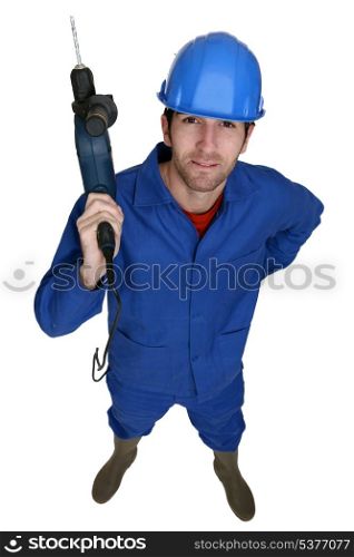 Tradesman holding up an electric screwdriver