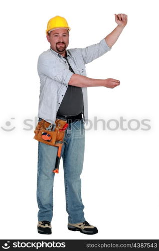 Tradesman holding up an imaginary board