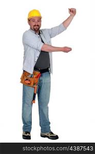 Tradesman holding up an imaginary board