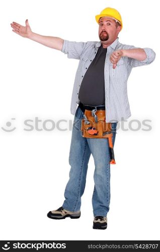 Tradesman pointing to an object and giving the thumb&rsquo;s down