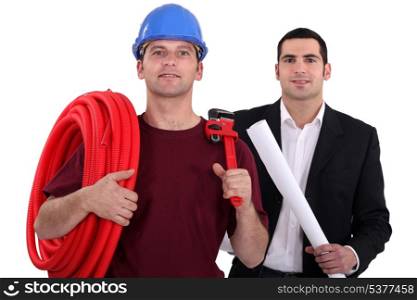 Tradesman posing with an engineer