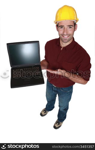 Tradesman showing off his new laptop