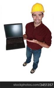 Tradesman showing off his new laptop