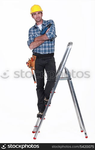 Tradesman standing on a stepladder