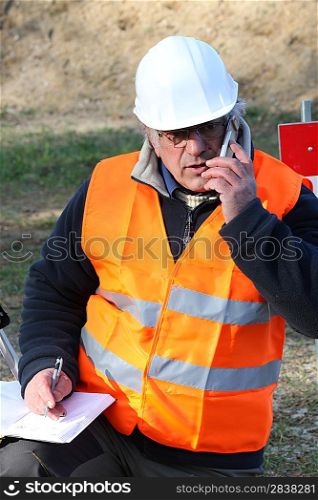 Tradesman talking on his mobile phone