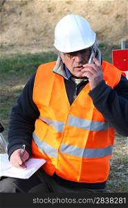 Tradesman talking on his mobile phone