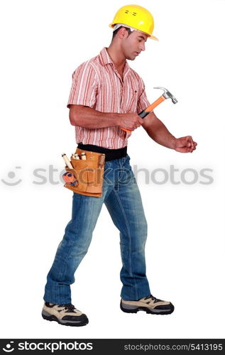 Tradesman using a hammer