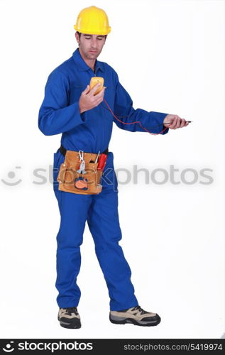 Tradesman using a multimeter