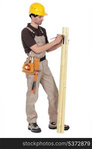 Tradesman using a try square to measure an angle