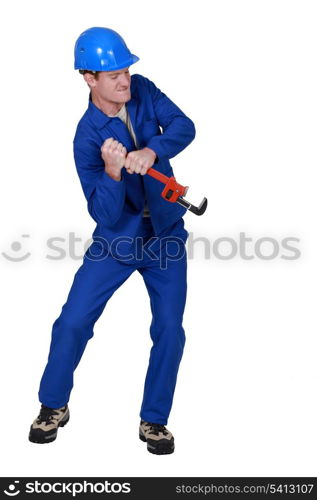 Tradesman using a wrench