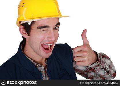 Tradesman winking and giving the thumb&acute;s up