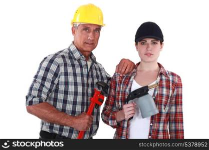 Tradespeople holding tools