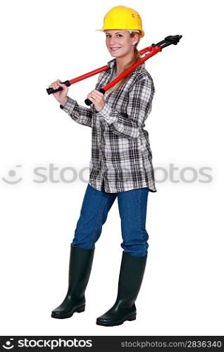 Tradeswoman carrying a pair of large clippers around her neck