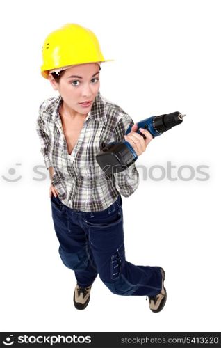 Tradeswoman holding a battery-powered power tool