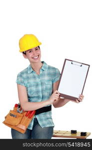 Tradeswoman holding a blank clipboard