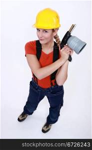 Tradeswoman holding a blowtorch