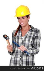 Tradeswoman holding a hammer and chisel